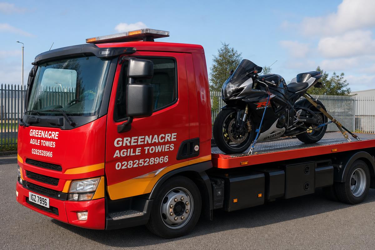 Motorbike strapped to a Greenacre Agile Towies flatbed truck
